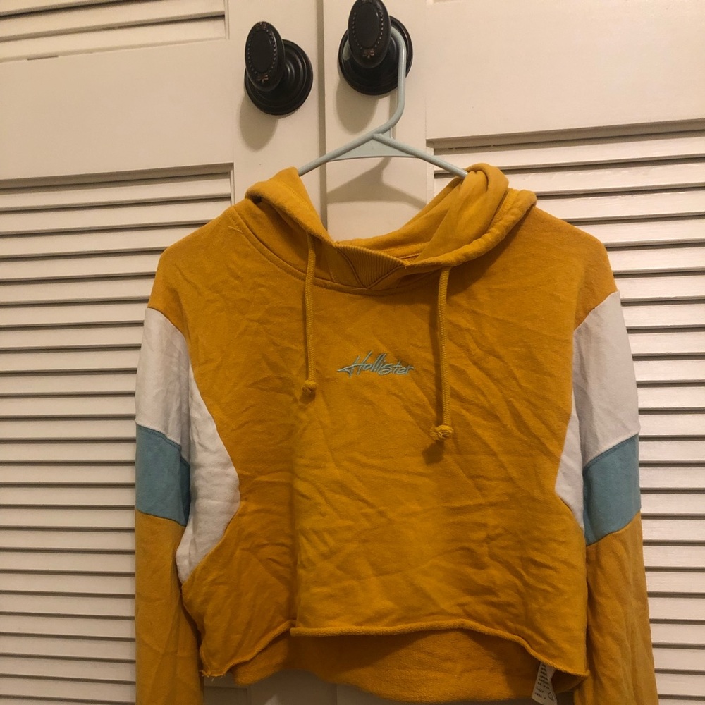 Hollister yellow, teal, and white cropped hoodie